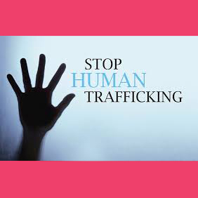 human hand extended upwards to words saying stop human trafficking